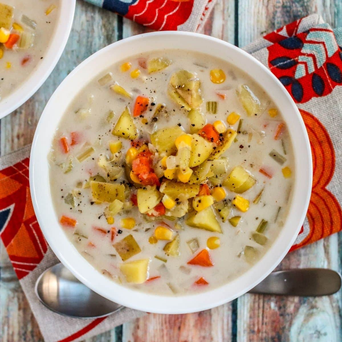 Bowl of chowder with a next to it.