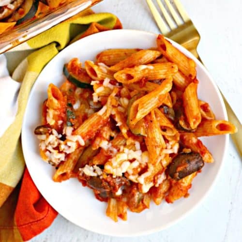 Baked pasta on a plate with a fork