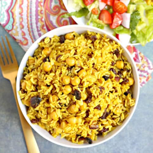 Overhead of white bowl with rice pilaf.