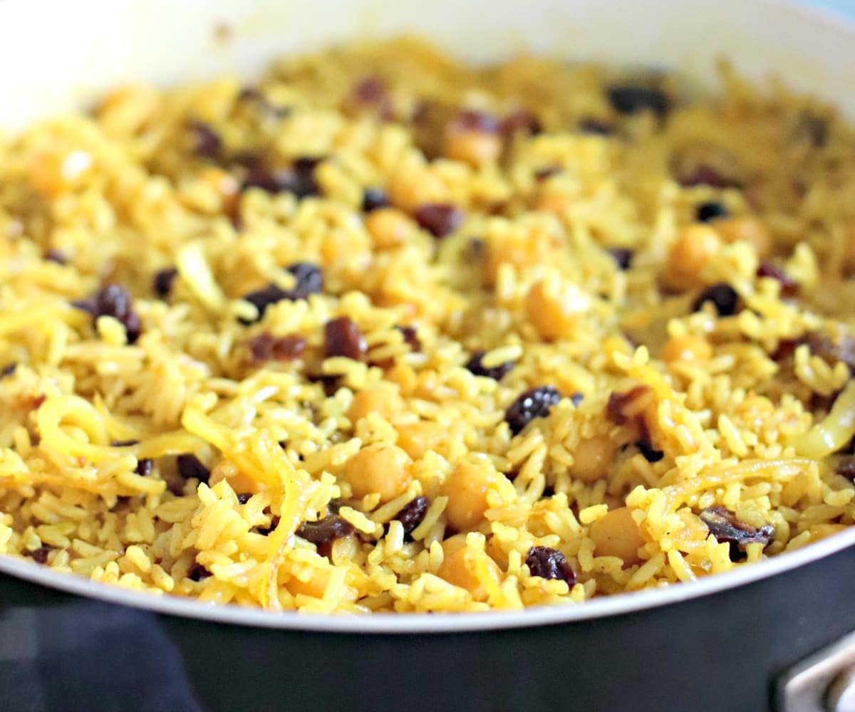 Rice pilaf in a skillet on the stove.