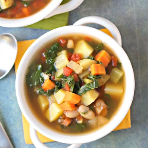 Overhead of white bowl filled with vegetable soup