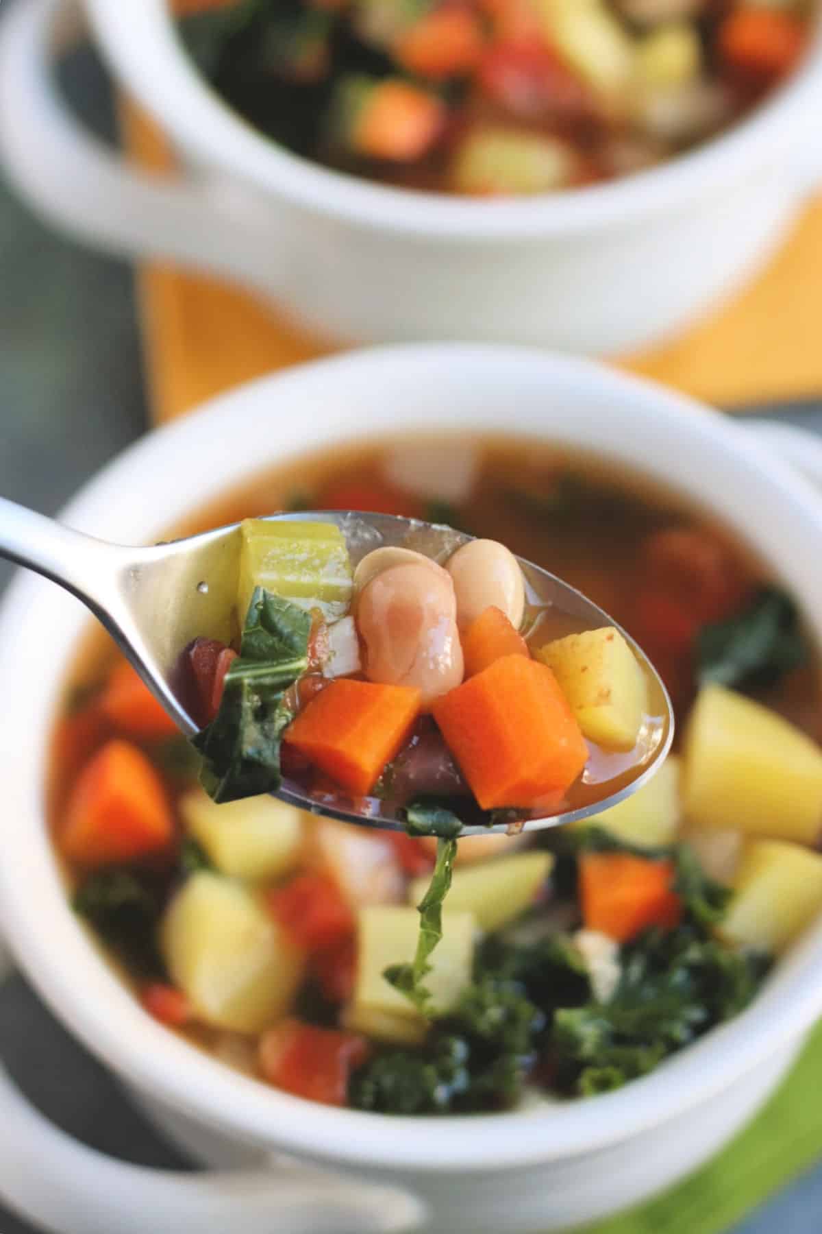 Closeup of Vegan Vegetable Soup on a spoon.