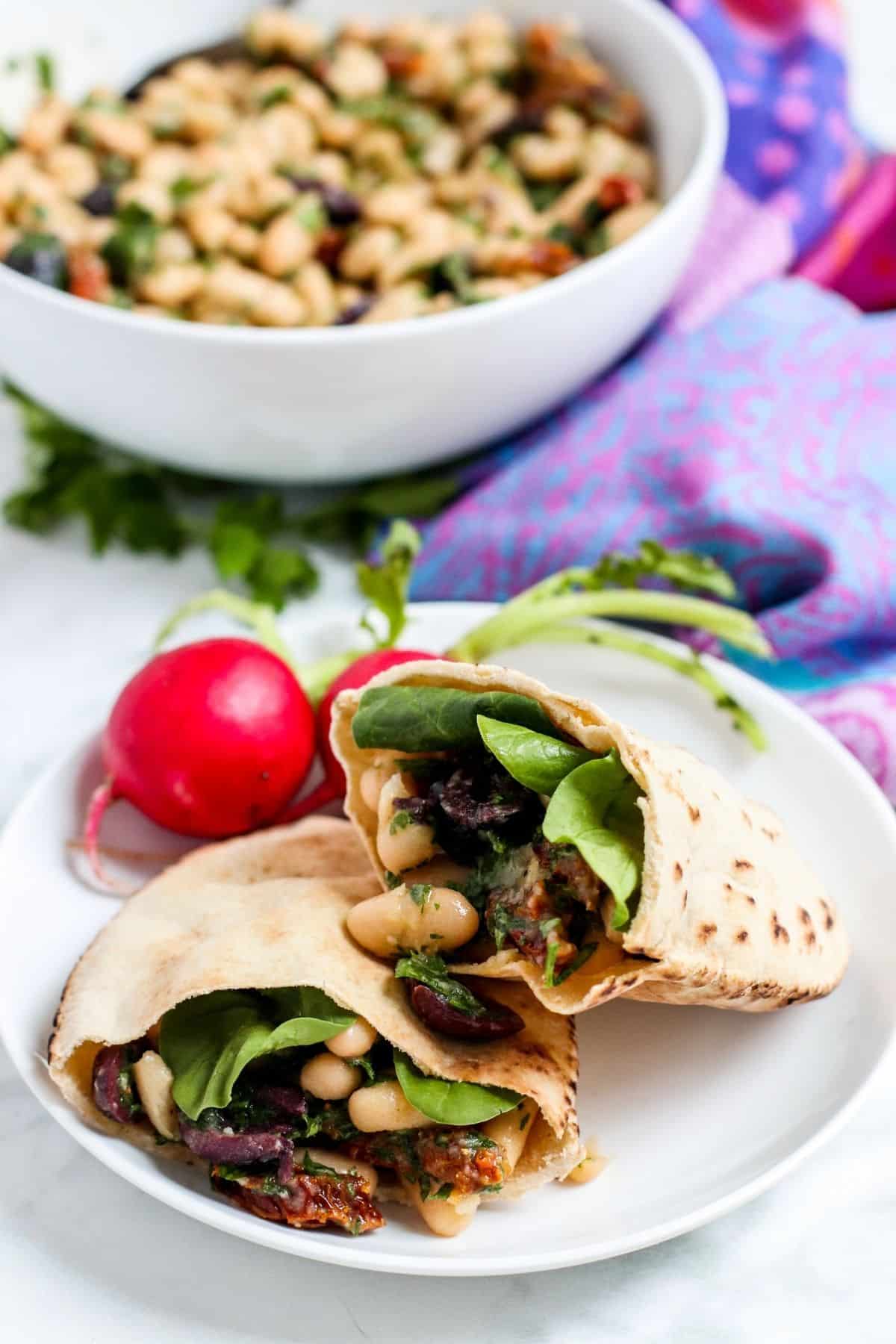 Pita pockets stuffed with spinach and white bean salad