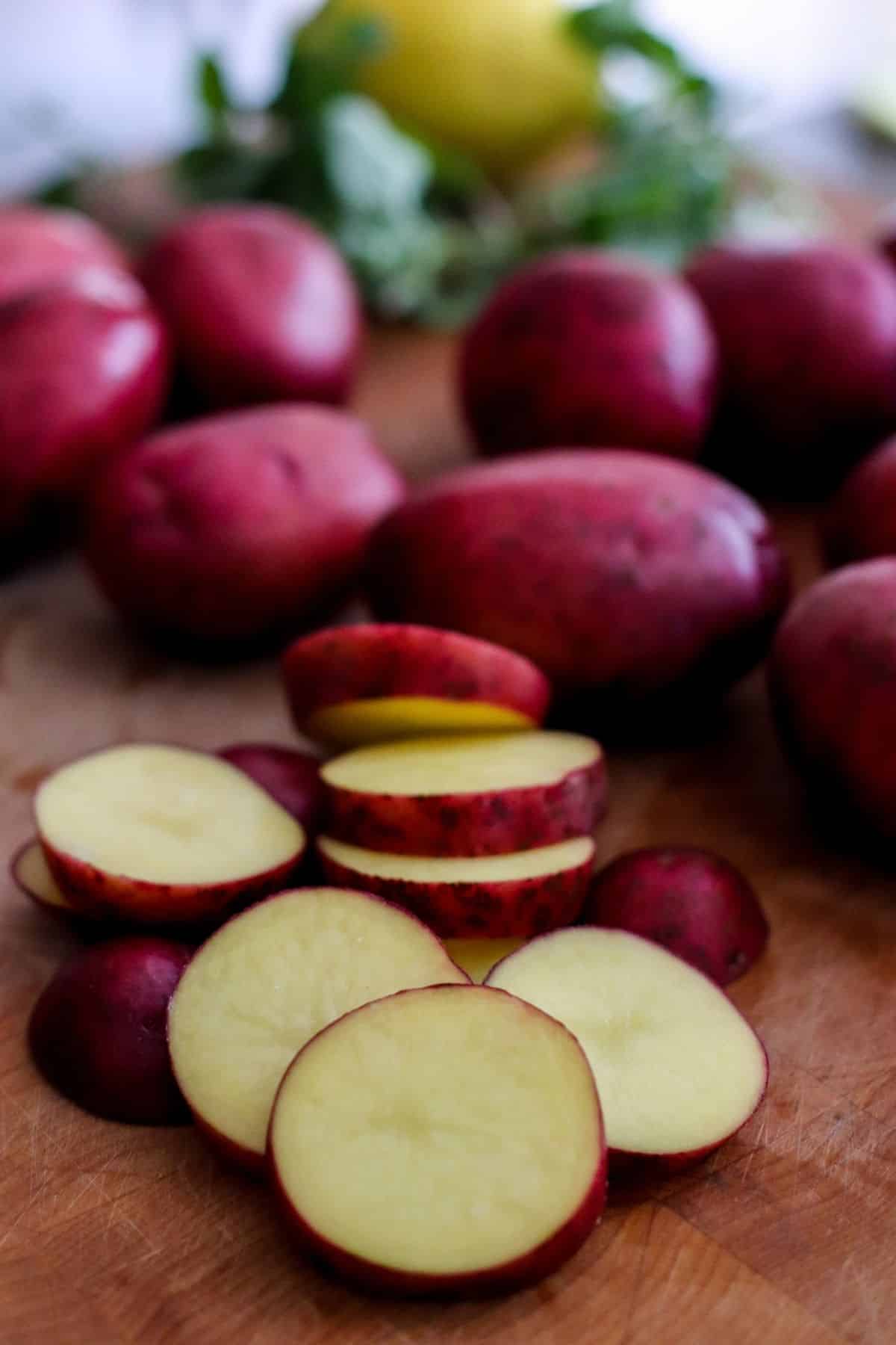 Sliced red potatoes on a cutting board
