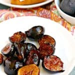 Caramelized figs on a plate with toast and bowl of fresh figs in the background