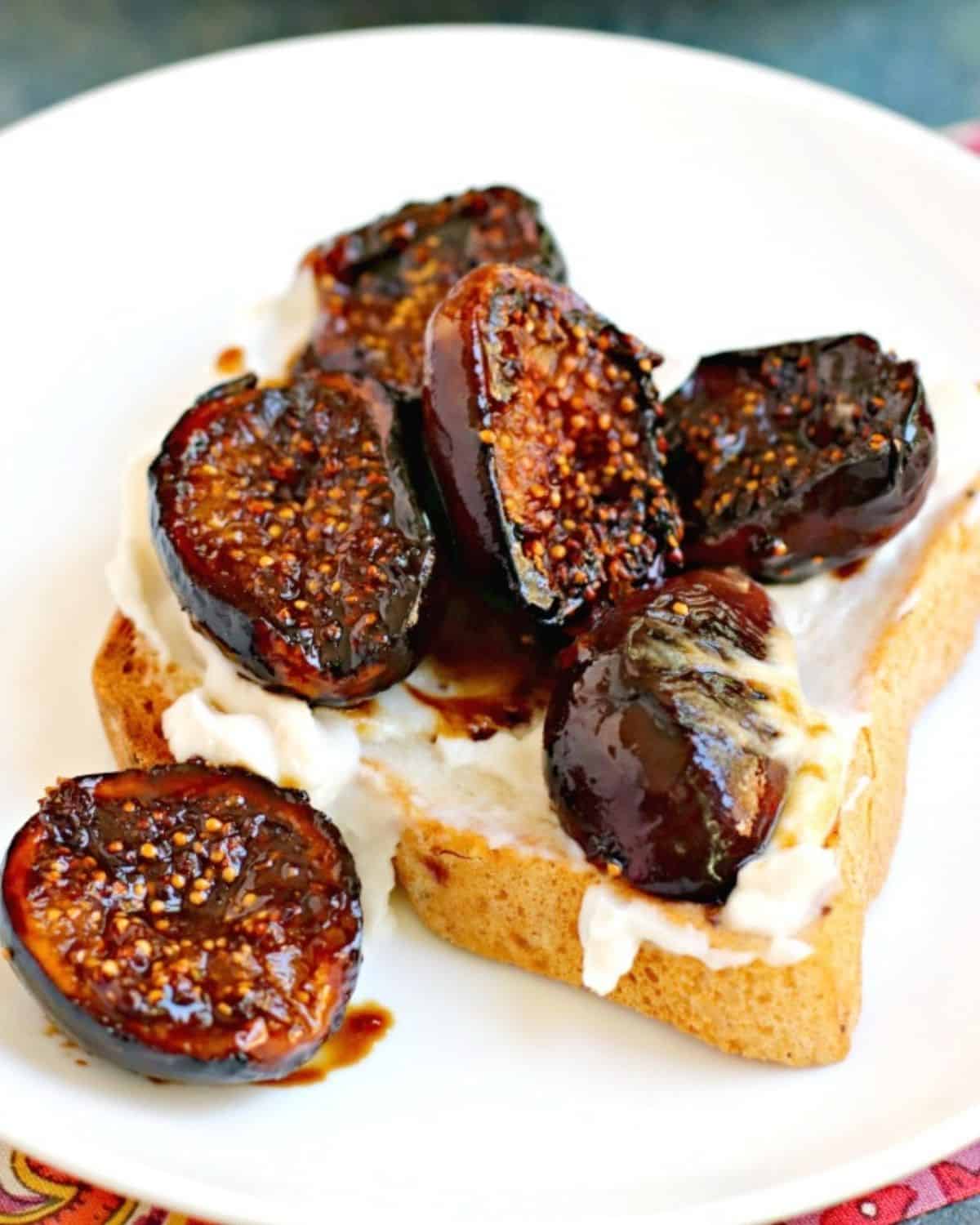 Slice of toast with cream cheese and figs