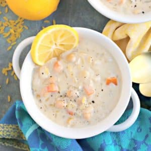 Bowl of soup with blue napkin.