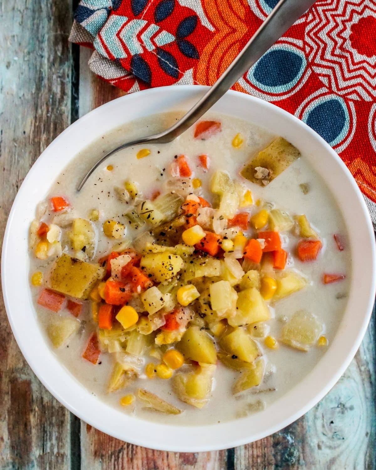 Close up of bowl of soup with spoon in it.