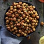 Bowl of chickpeas with cut lemon next to it