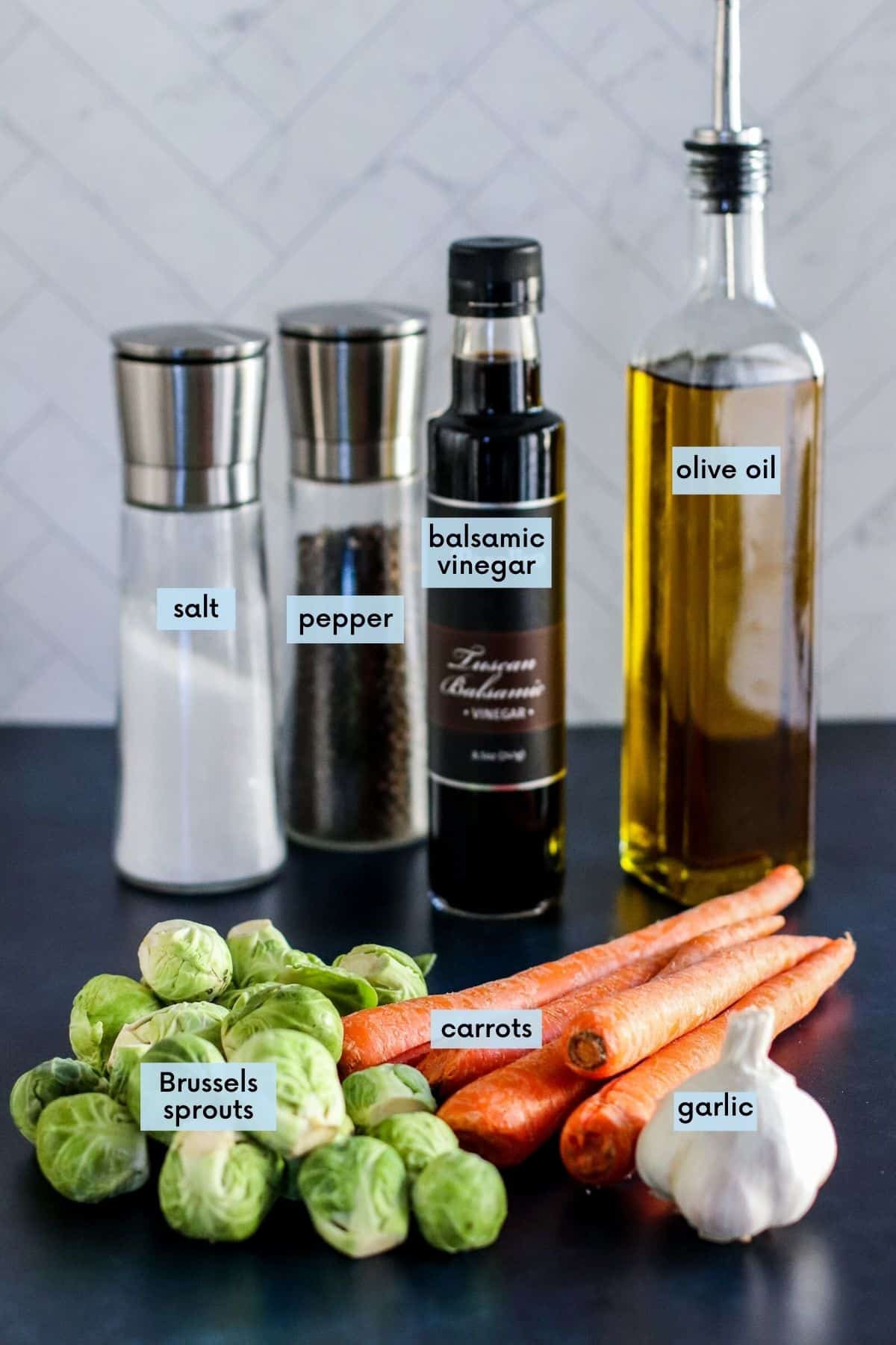 Labeled ingredients needed to make this recipe: Brussels sprouts, carrots, garlic, olive oil, balsamic vinegar, salt and pepper.