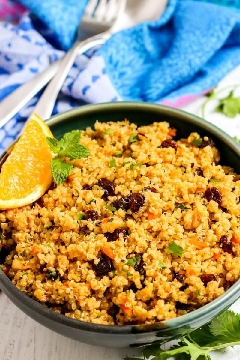 Close up of bowl of orange quinoa.