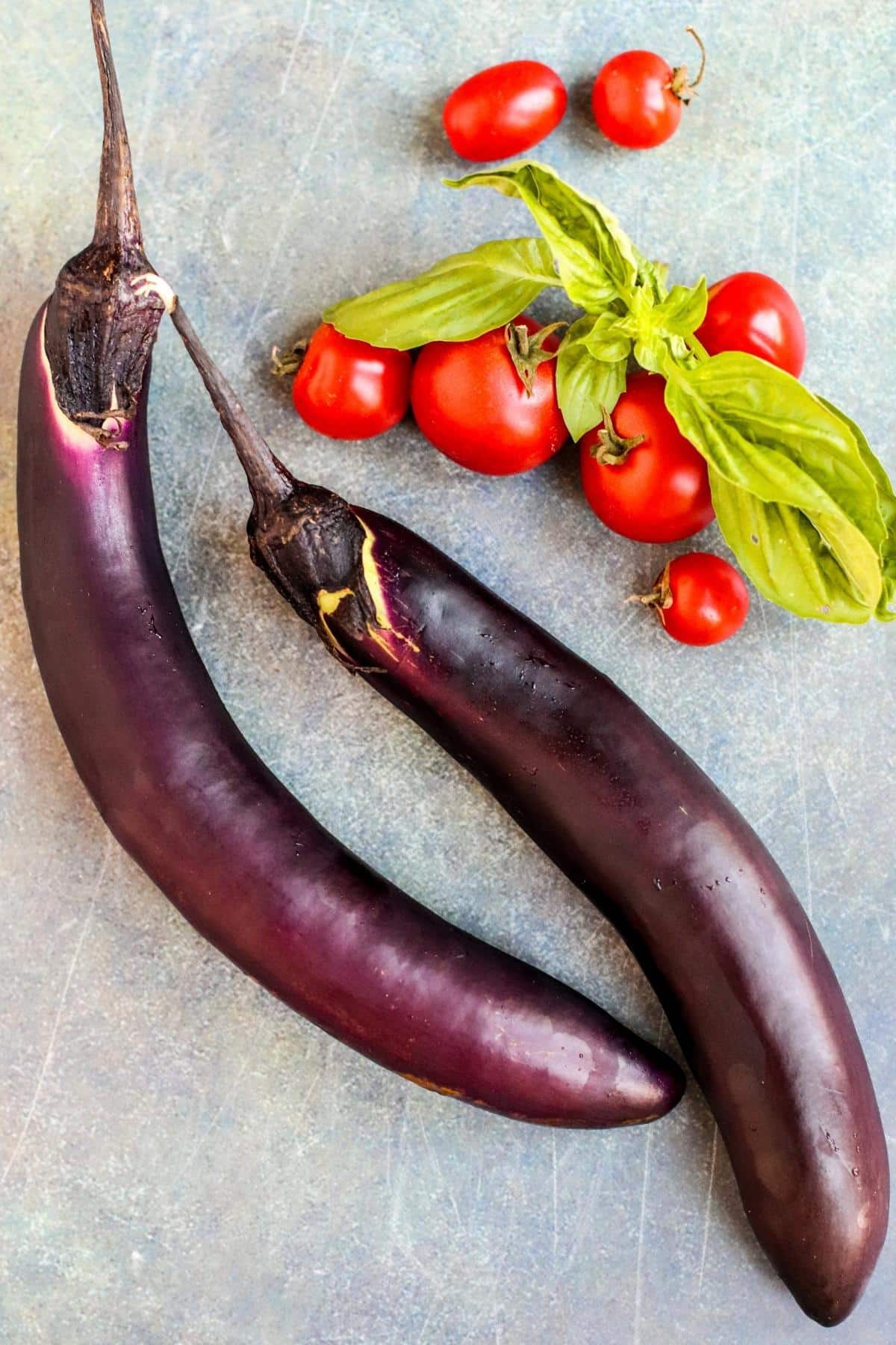 Japanese eggplants, cherry tomatoes, and fresh basil.