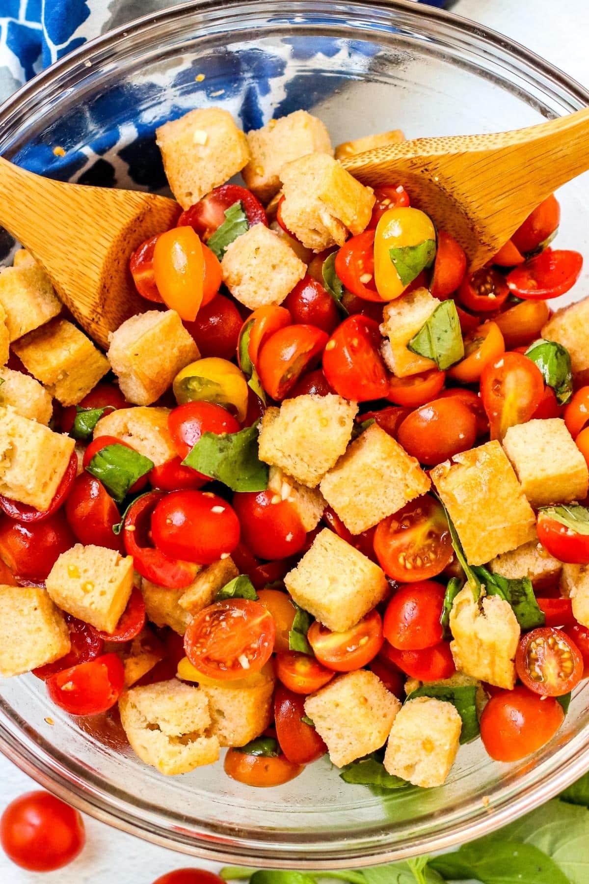 Close up of bowl of Sourdough Panzanella being tossed.