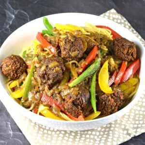 Bowl of Rasta Pasta topped with walnut meatballs.