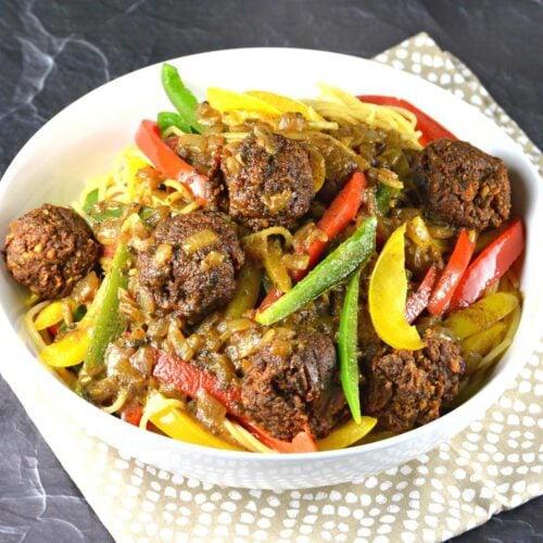 Bowl of Rasta Pasta topped with walnut meatballs.