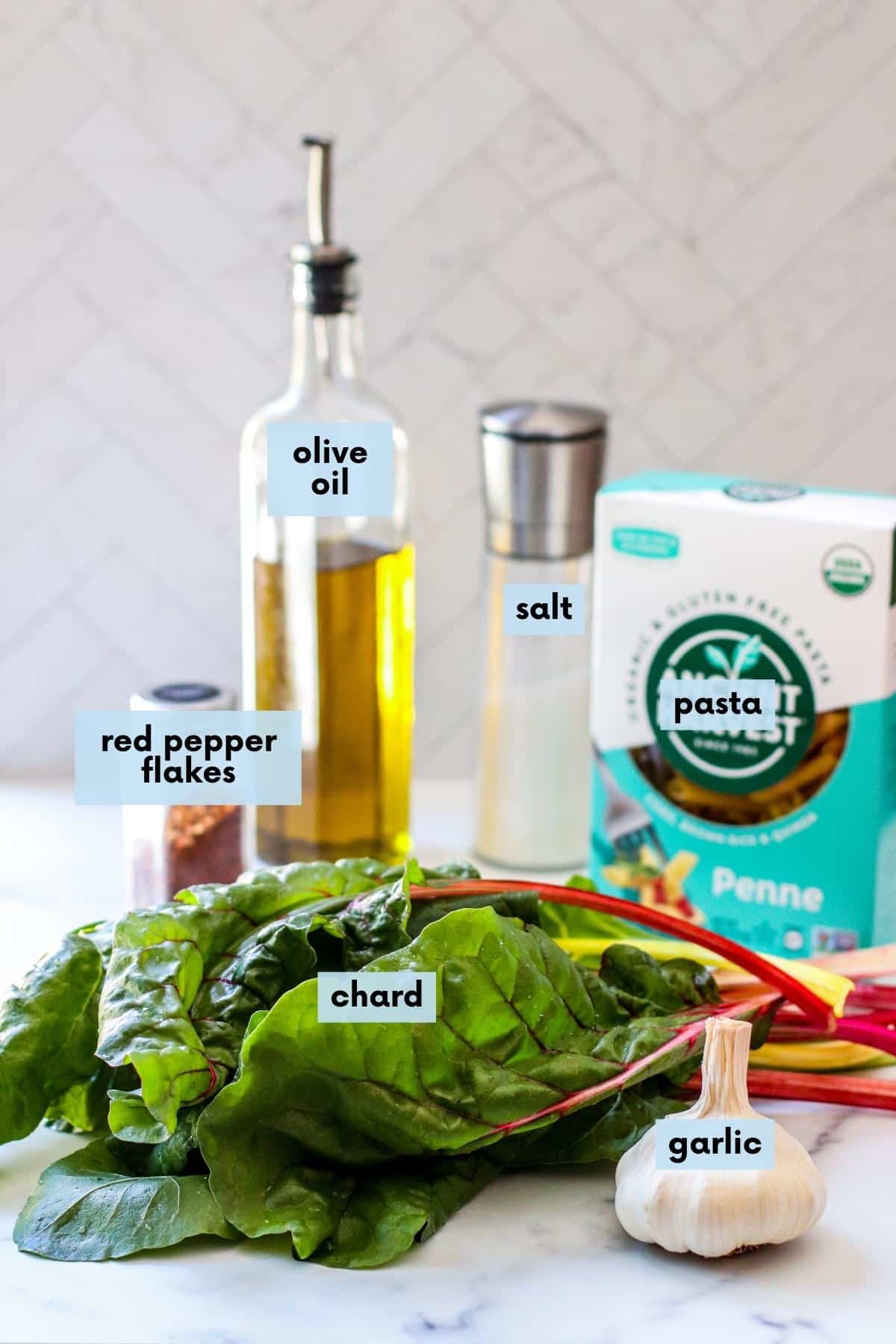 Labeled ingredients needed to make this recipe: Olive oil, salt, pasta, red pepper flakes, chard, and garlic.