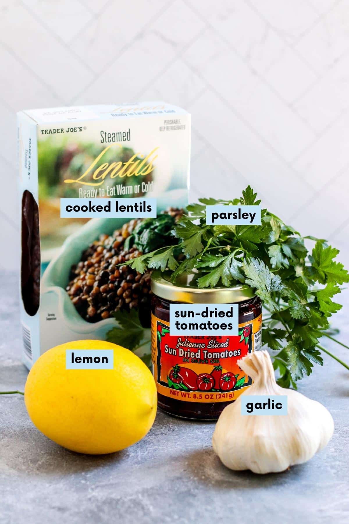 Labeled ingredients needed to make this recipe: Cooked lentils, parsley, sun-dried tomatoes in olive oil, garlic, and lemon.