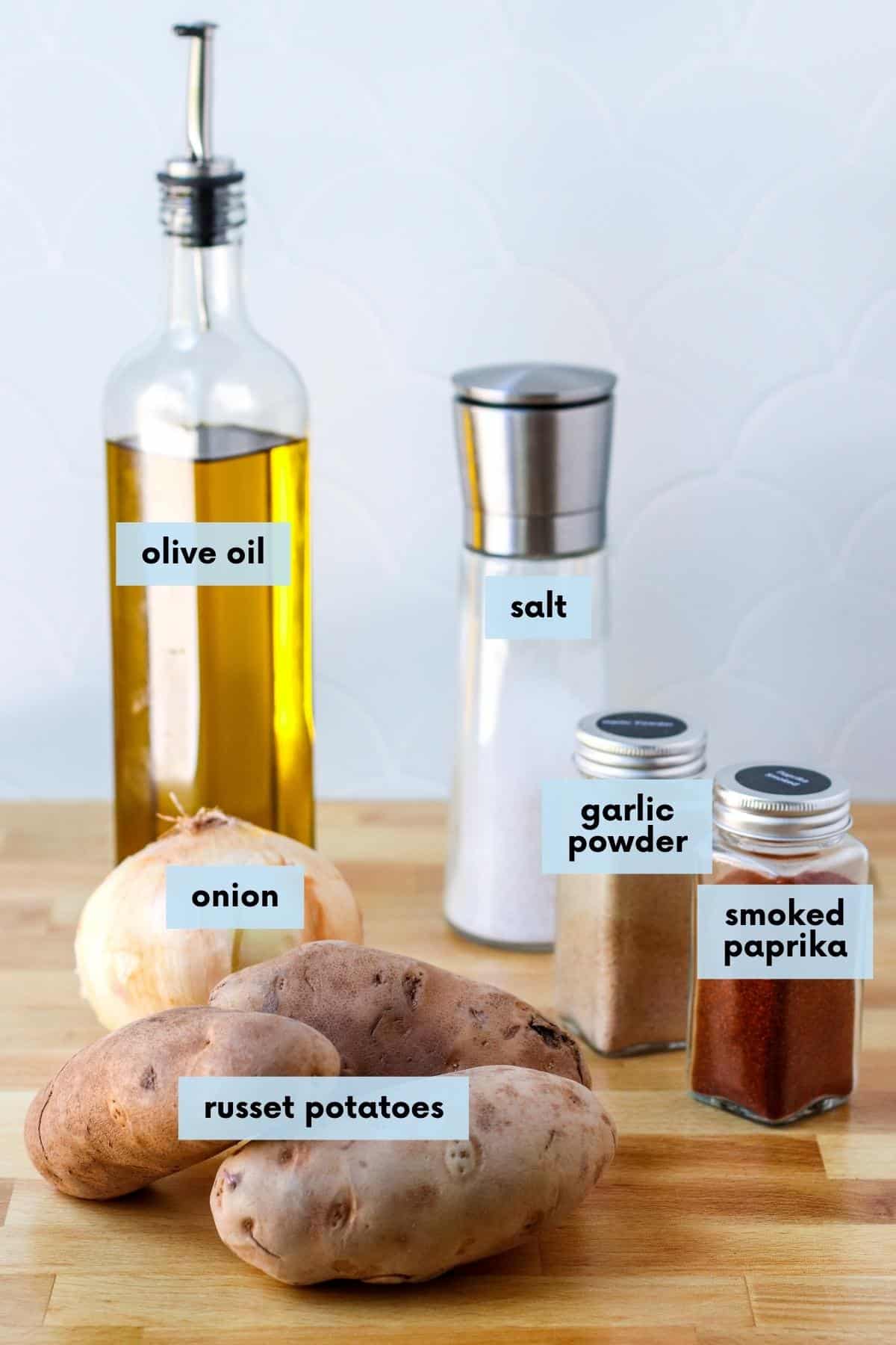 Labeled ingredients needed to make this recipe: Olive oil, salt, garlic powder, smoked paprika, onion, and russet potatoes.