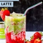 Strawberry Matcha Latte in a glass with a straw with fresh strawberries next to it and text overlay Strawberry Matcha Latte.