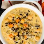 Bowl of soup with text overlay Vegan Wild Rice Soup - Instant Pot Recipe.