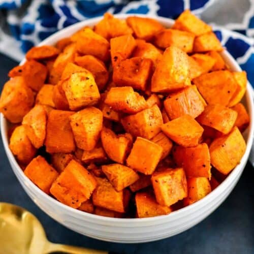 Bowl of roasted cubed sweet potatoes.