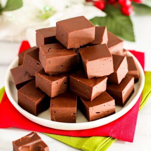 Plate of cubes of vegan fudge on red and green napkins.