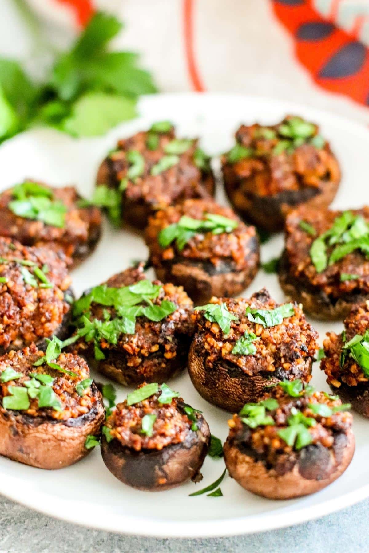 Stuffed mushrooms on a serving plate.