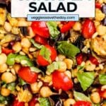 Salad made with chickpeas, tomatoes, eggplant, basil, and pine nuts with text overlay Mediterranean Eggplant Chickpea Salad.