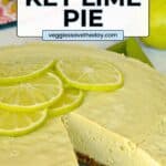 Dessert on a platter with a slice take out and text overlay Raw Vegan Key Lime Pie.