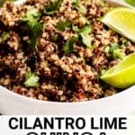 Bowl of quinoa garnished with lime wedges with text overlay Cilantro Lime Quinoa.