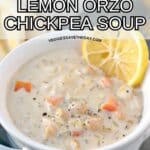 Bowl of soup garnished with lemon slice and text overlay Vegan Lemon Orzo Chickpea Soup.