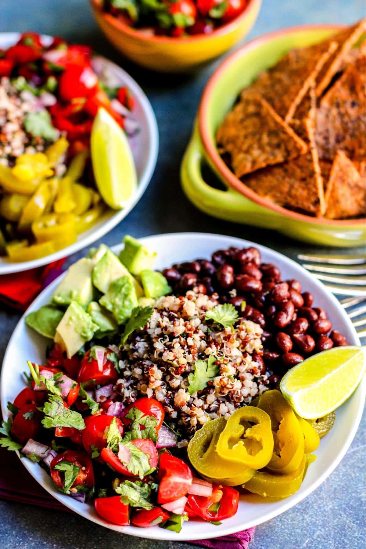 Burrito Bowls and a bowl of tortilla chips.