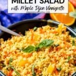 Serving bowl of grain salad with text overlay Orange Millet Salad with Maple Dijon Vinaigrette.
