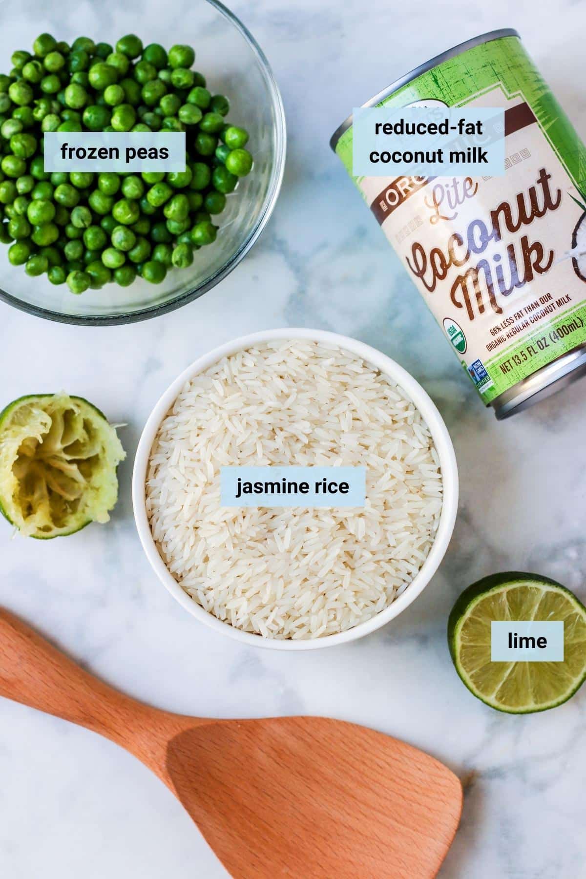 Jasmine rice, frozen peas, can of lite coconut milk, cut lime, and a rice paddle.