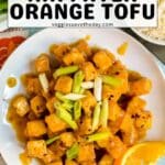 Tofu on a plate with text overlay Air Fryer Orange Tofu.