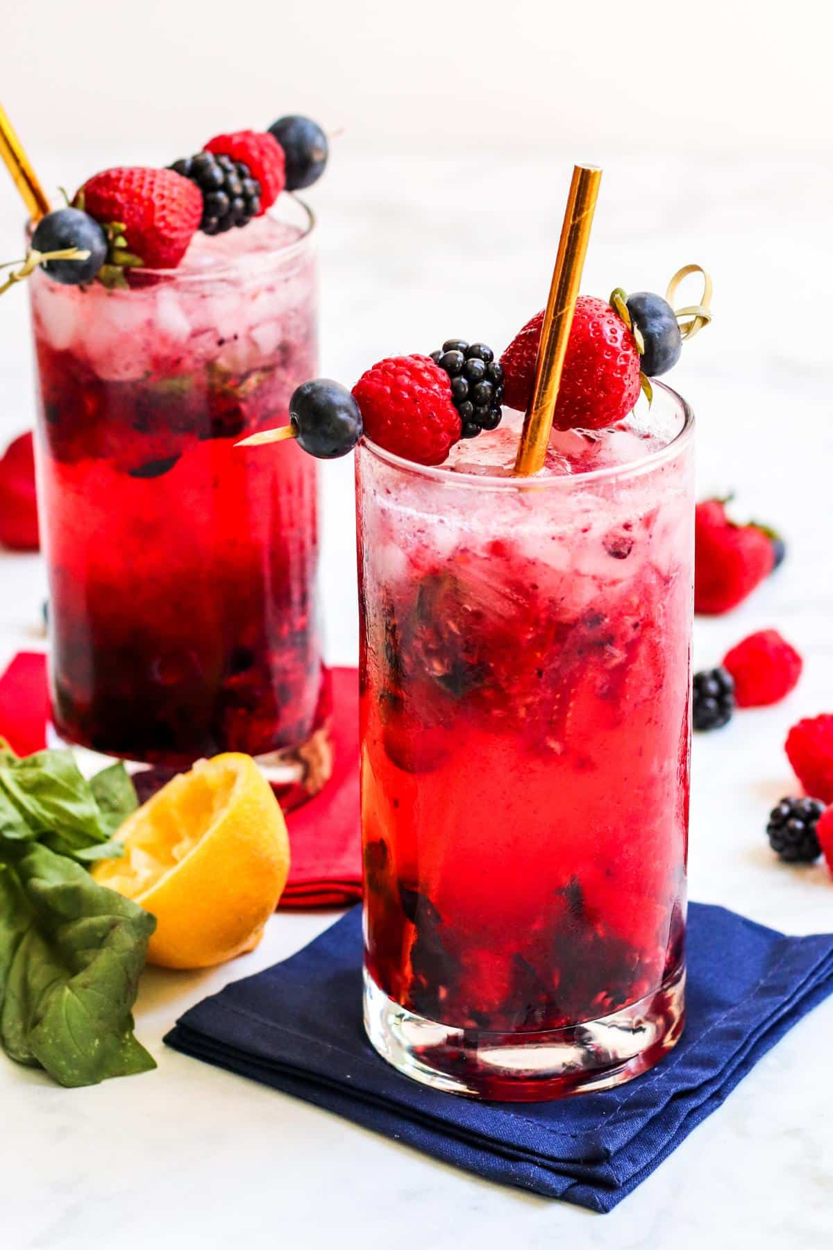 Berry Vodka Cocktails garnished with fresh berries.
