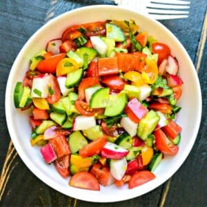 Bowl of Cucumber Tomato Bell Pepper Salad.