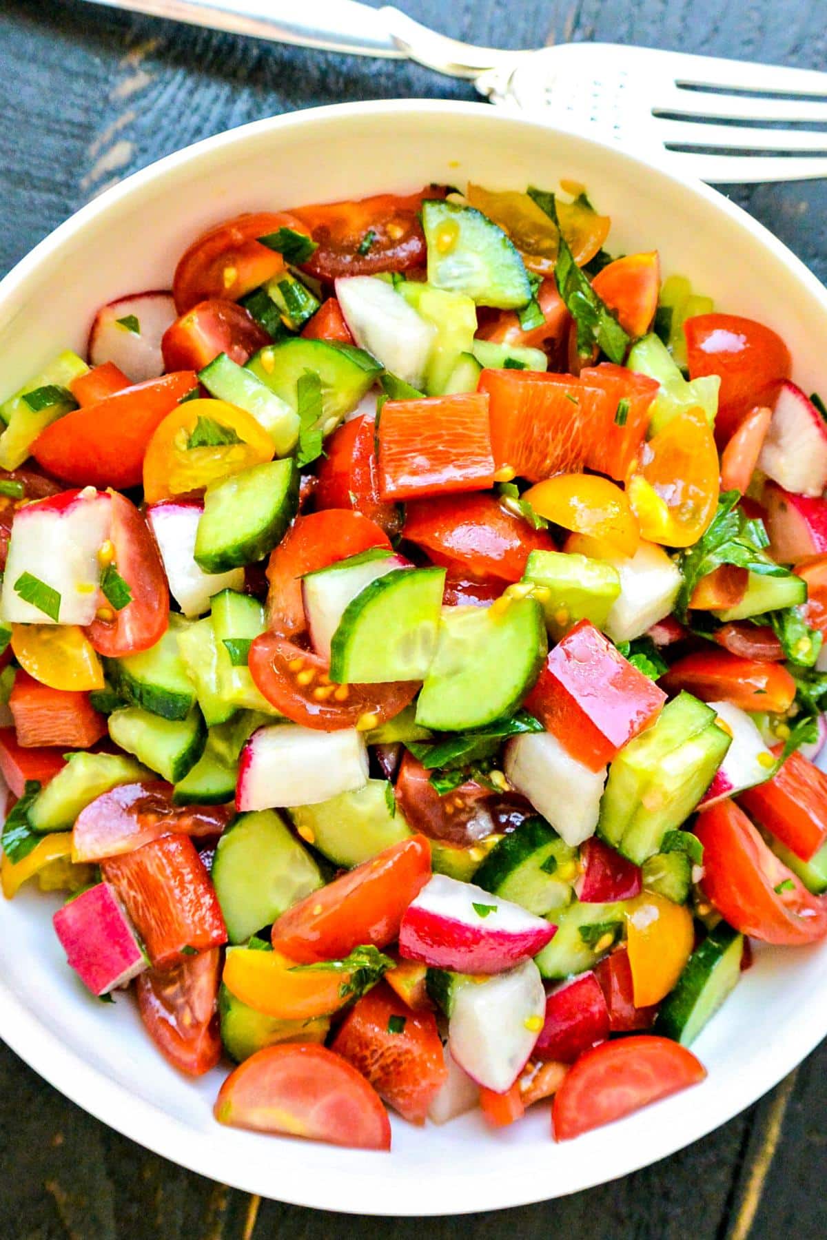 Bowl of Cucumber Tomato Bell Pepper Salad.