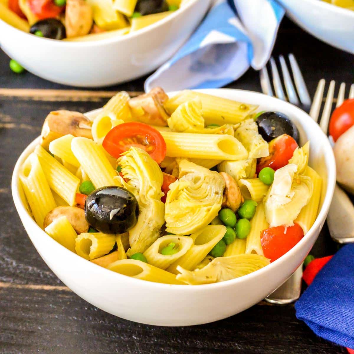 Bowl of penne pasta salad.