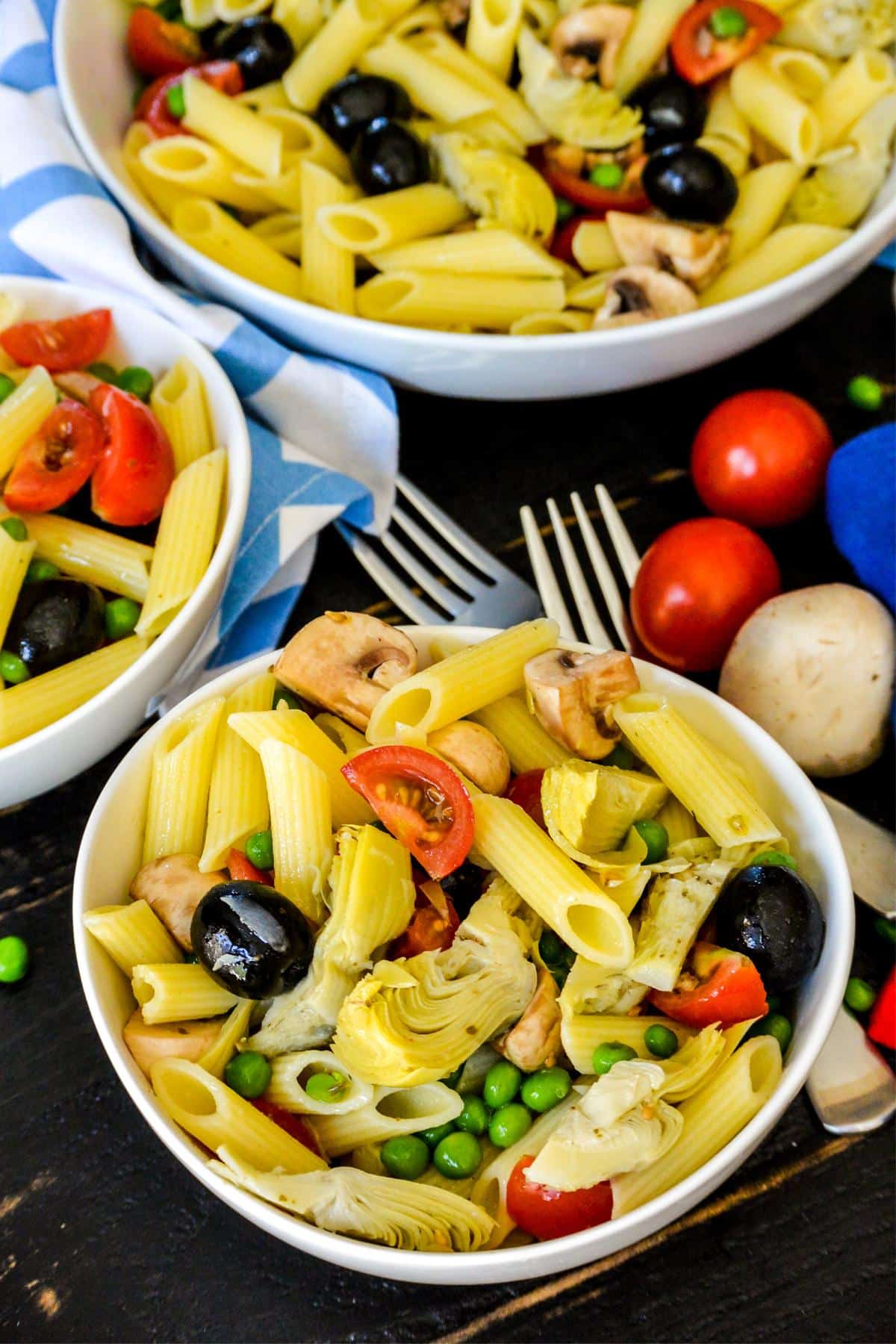 Bowls of marinated artichoke hearts pasta salad.