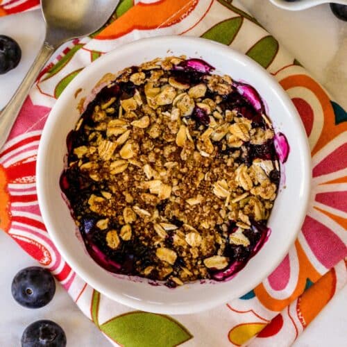 Blueberry crisp in a ramekin.