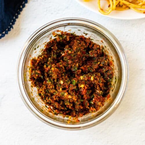 Vegan Sun-Dried Tomato Pesto in a glass jar.