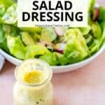 Bottle of dressing and a green salad with text overlay: Creamy Hummus Salad Dressing.