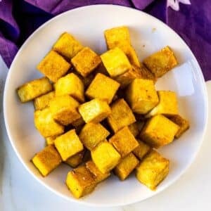 Plate of crispy maple Dijon tofu cubes.
