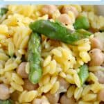 Close up of a bowl of lemon asparagus orzo with chickpeas.