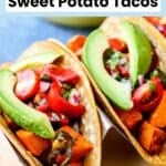 Tacos filled with roasted sweet potatoes, fresh cherry tomato salsa, and sliced avocado, with text overlay: Sweet Potato Tacos.